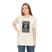 DailyThreadCo. cream 100% cotton t-shirt with a black and white graphic of The Lovers tarot card, featuring skeletons, angelic figures, sun, moon, and flames.