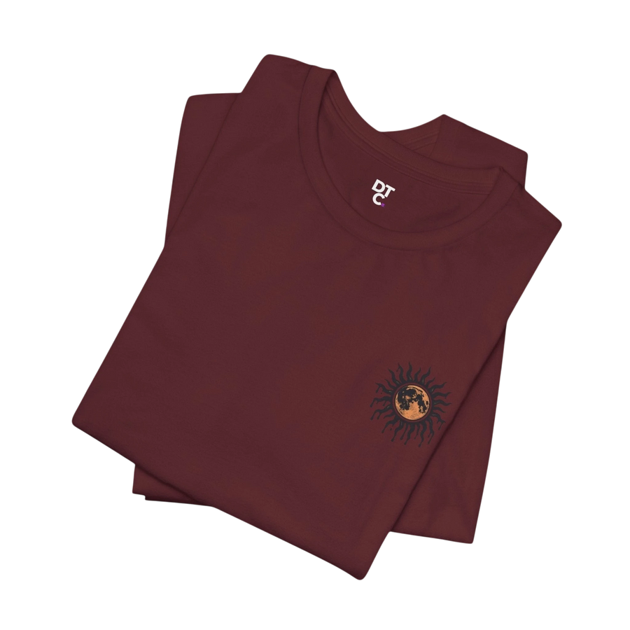 DailyThreadCo. maroon 100% cotton tee with a celestial sun and moon graphic on the chest. Relaxed fit, crew neck.
