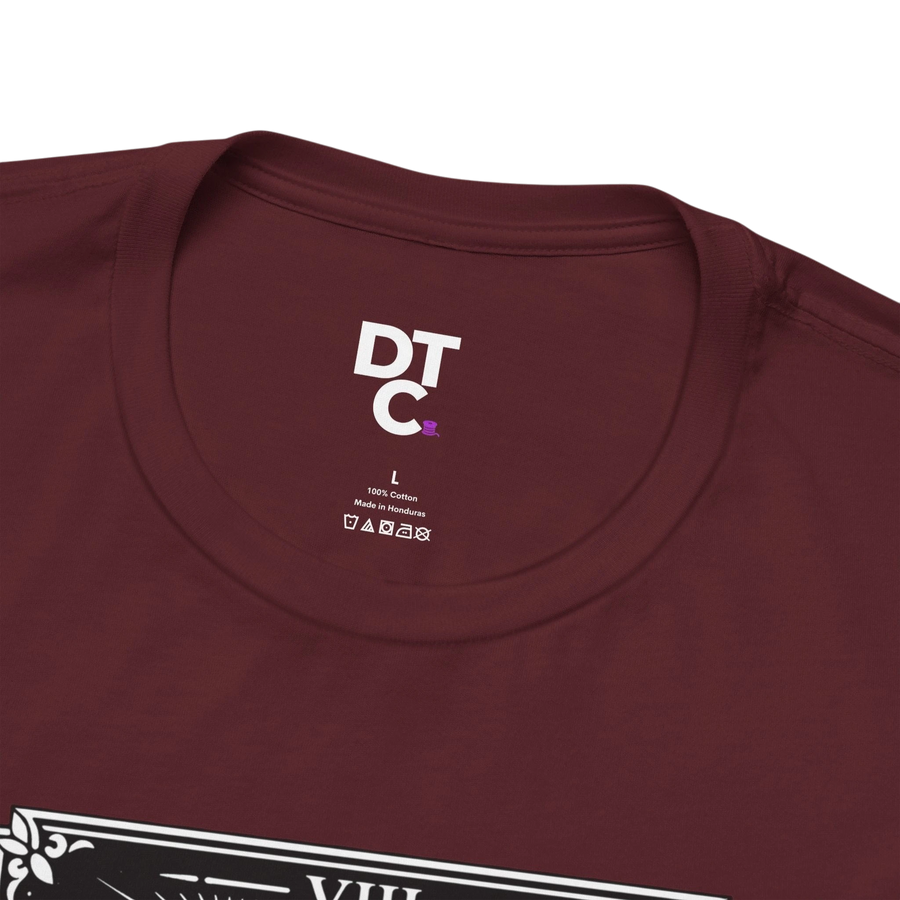 DailyThreadCo. maroon 100% cotton crew neck t-shirt with vintage Strength tarot card illustration of a woman and lion.