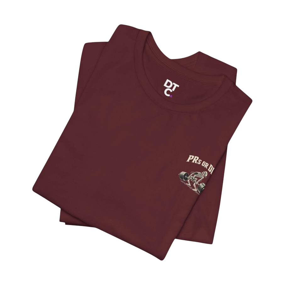 DailyThreadCo. maroon 100% cotton t-shirt with a skeleton deadlifting graphic and "PRs or Die" text on the back.
