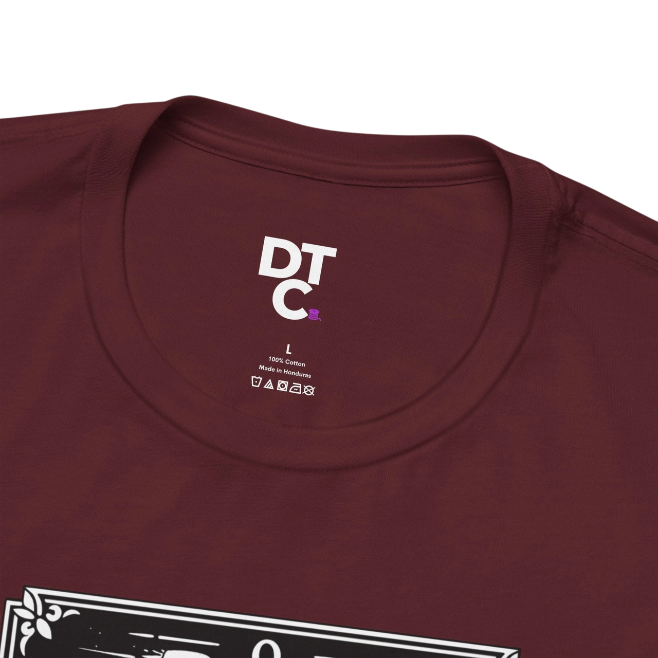 DailyThreadCo. maroon 100% cotton t-shirt with 'The Fool' tarot card graphic on the front.