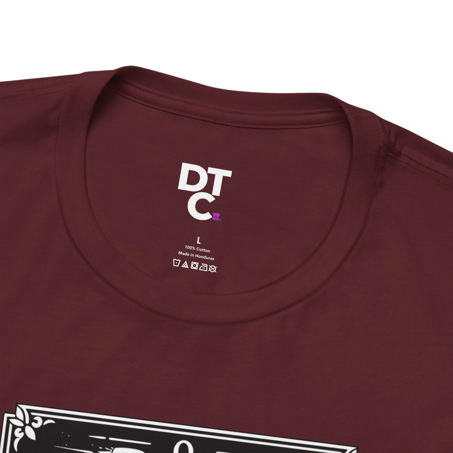 DailyThreadCo. maroon 100% cotton t-shirt with 'The Fool' tarot card graphic on the front.