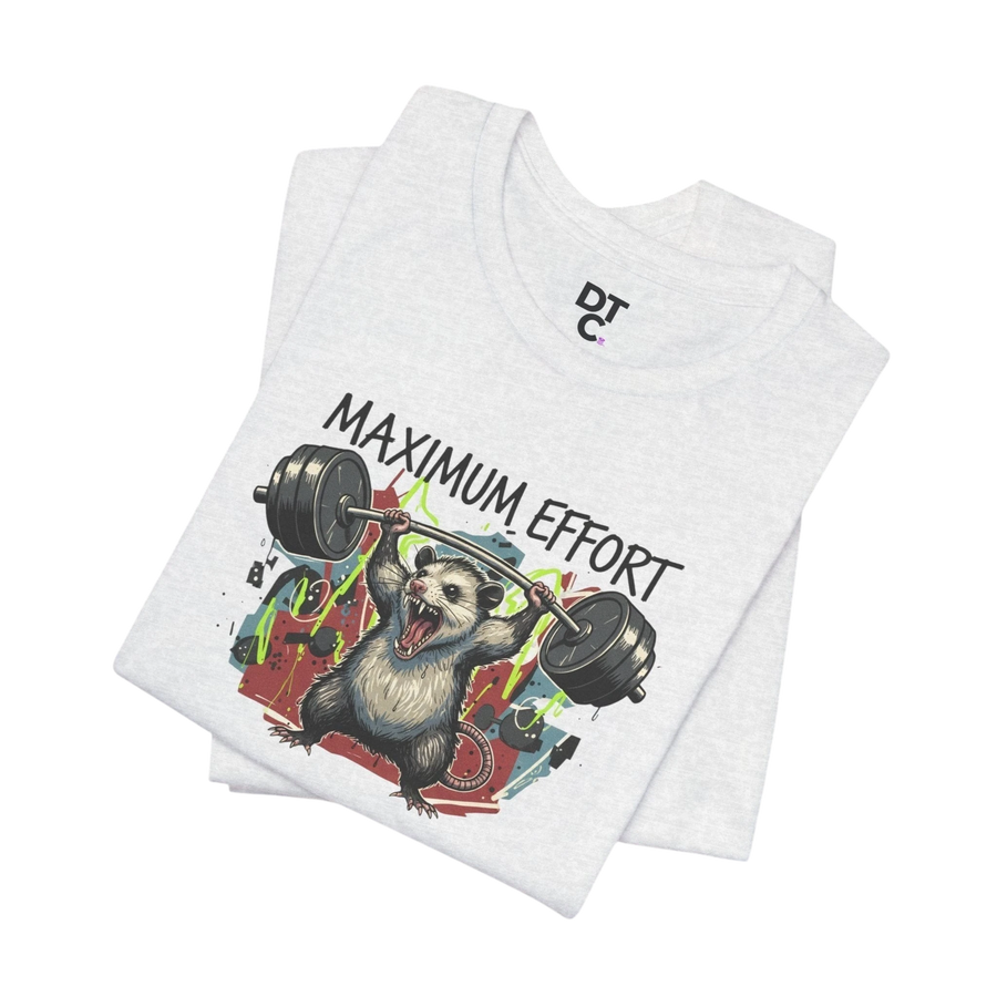 DailyThreadCo. light grey heather 100% cotton t-shirt with a graphic of a possum lifting a barbell and the text "MAXIMUM EFFORT".