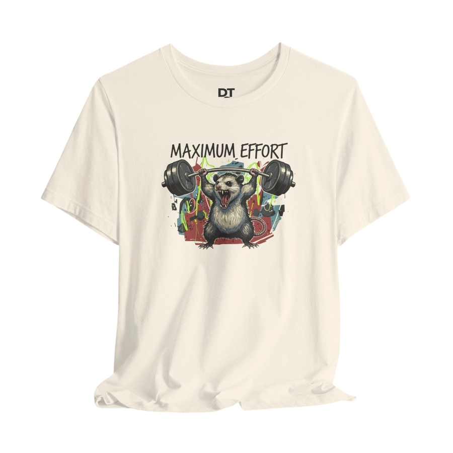 DailyThreadCo. cream 100% cotton t-shirt with a graphic of a possum lifting a barbell and the text "MAXIMUM EFFORT".