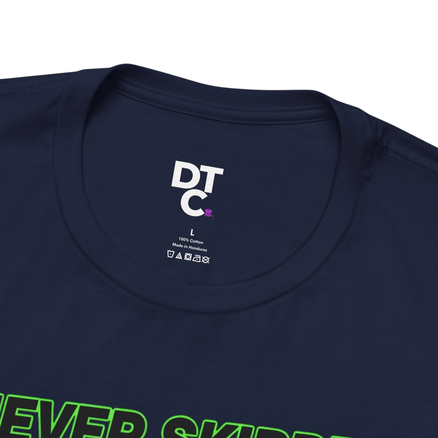 DailyThreadCo. navy blue 100% cotton t-shirt with neon green text graphic that says "Never Skipped Chest Day".