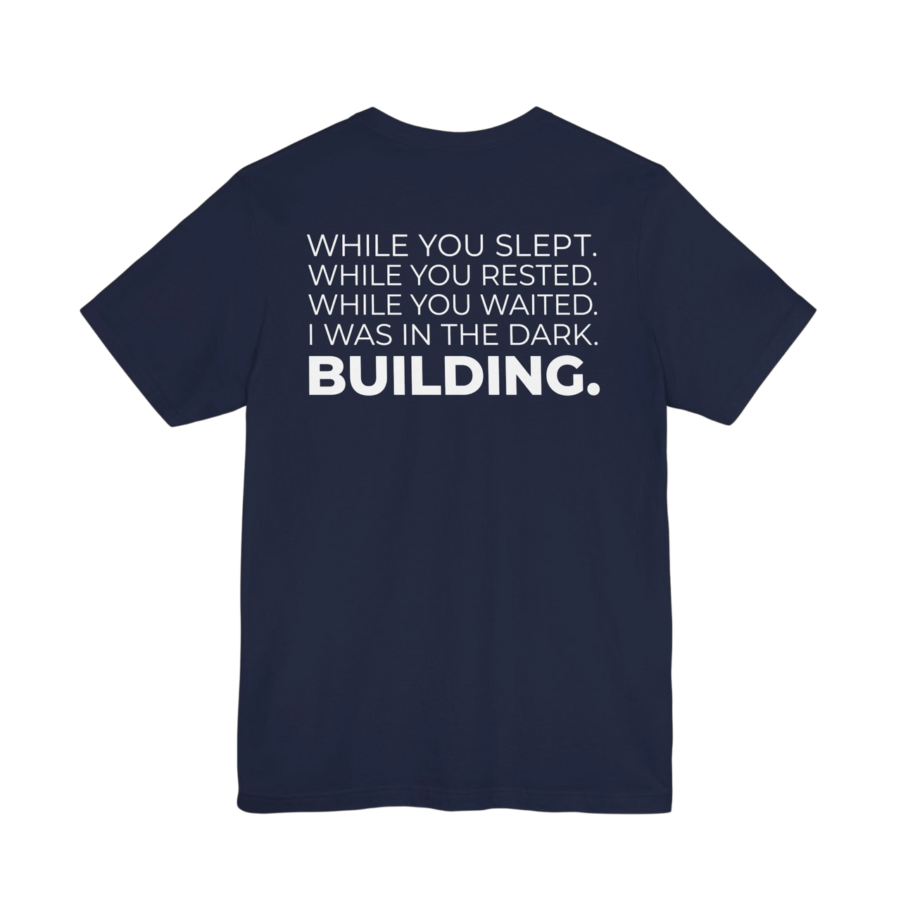 DailyThreadCo. navy blue cotton t-shirt with white text that reads 'WHILE YOU SLEPT. WHILE YOU RESTED. WHILE YOU WAITED. I WAS IN THE DARK. BUILDING.'