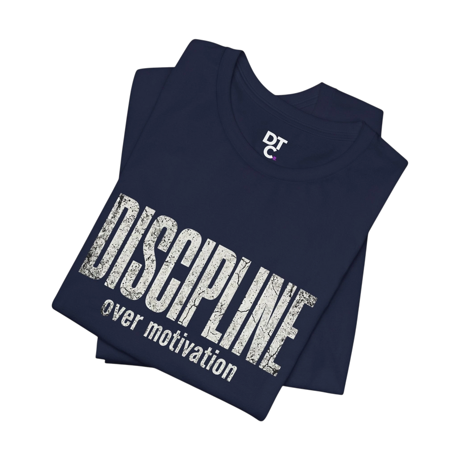 DailyThreadCo. navy blue 100% cotton t-shirt with distressed white text reading "DISCIPLINE over motivation".