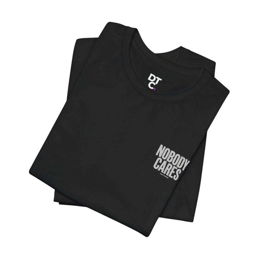 DailyThreadCo. black 100% cotton graphic tee with "Nobody Cares" text and DTC logo. Crew neck, short sleeves.