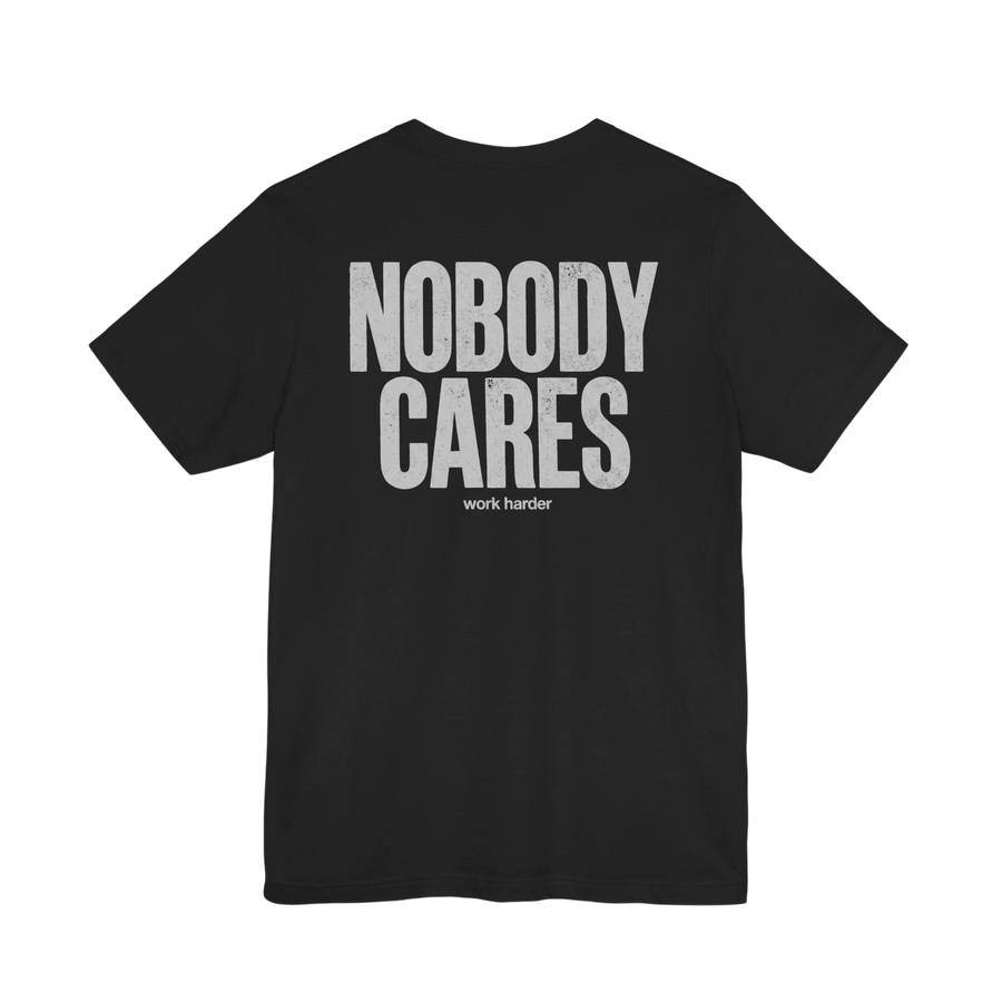 DailyThreadCo. black 100% cotton graphic tee with white distressed "NOBODY CARES" text and "work harder" below.