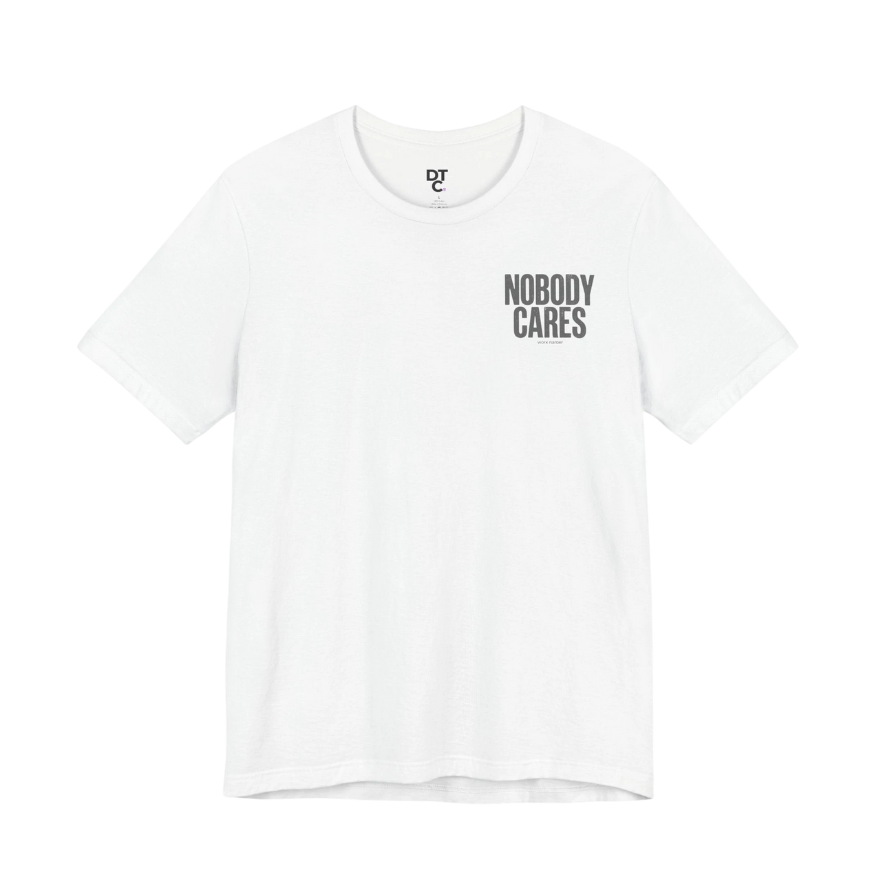 DailyThreadCo. white cotton graphic tee with "Nobody Cares" text print on the chest and a small logo on the collar.