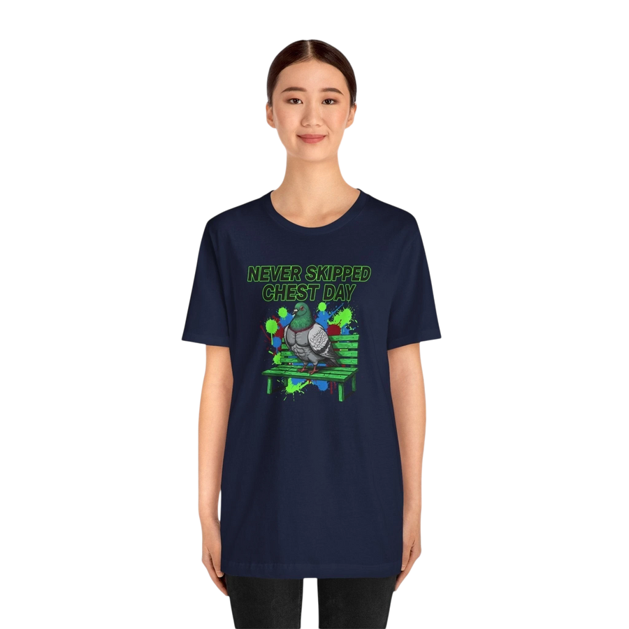 DailyThreadCo. navy blue cotton t-shirt with a graphic print of a pigeon on a bench, text reads "NEVER SKIPPED CHEST DAY".