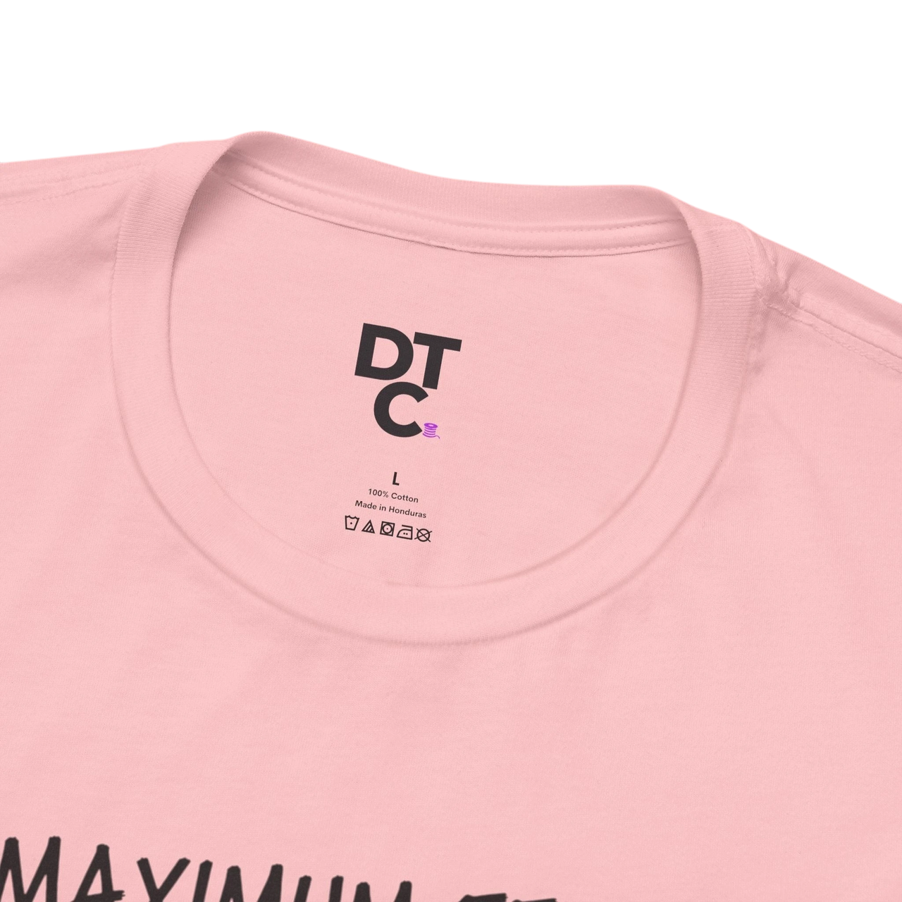 DailyThreadCo. pink 100% cotton t-shirt with "MAXIMUM EFFORT" graphic and DT C logo on tag.