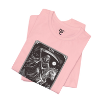 DailyThreadCo. pink cotton t-shirt with a black and white Death Tarot card graphic featuring a skeleton on a horse.