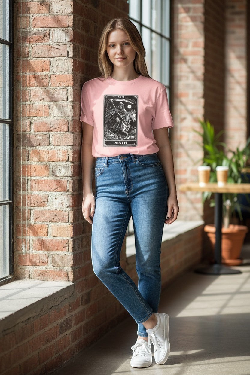 DailyThreadCo. pink cotton t-shirt with a black and white Death Tarot card graphic featuring a skeleton on a horse.