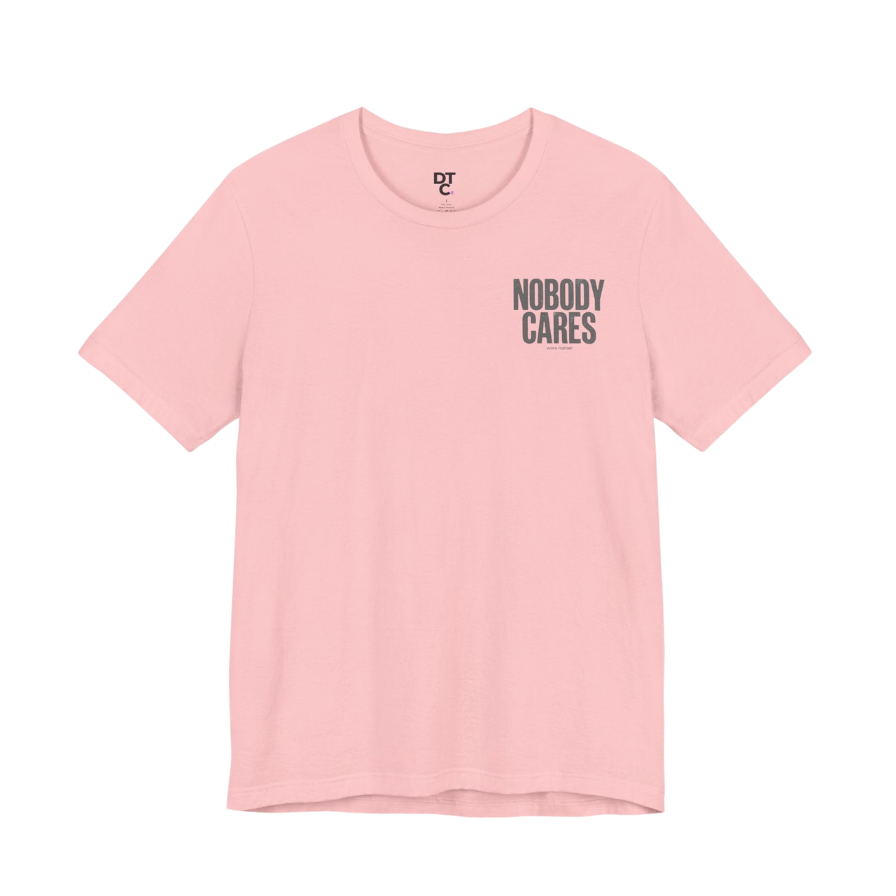 DailyThreadCo. light pink 100% cotton graphic tee with "NOBODY CARES" text art on the chest.