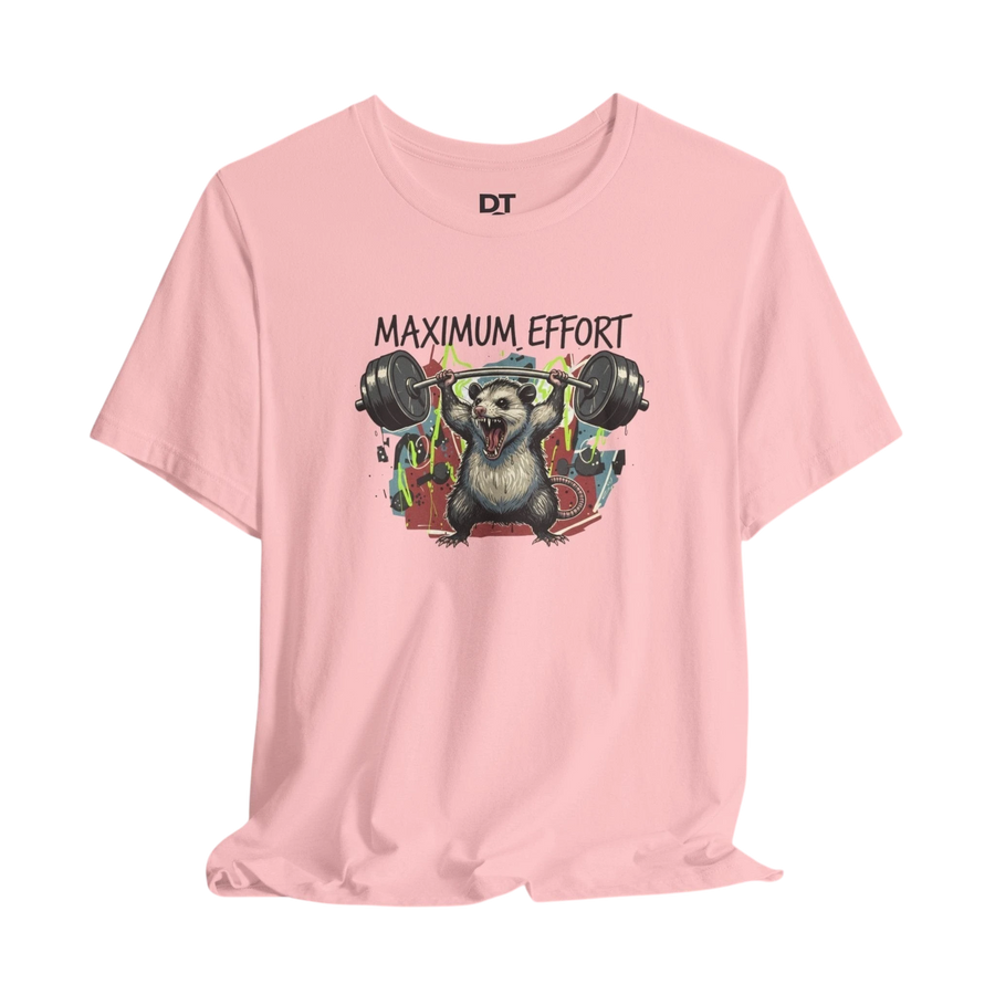 DailyThreadCo. pink 100% cotton t-shirt with a graphic of a possum lifting a barbell and the text "MAXIMUM EFFORT".
