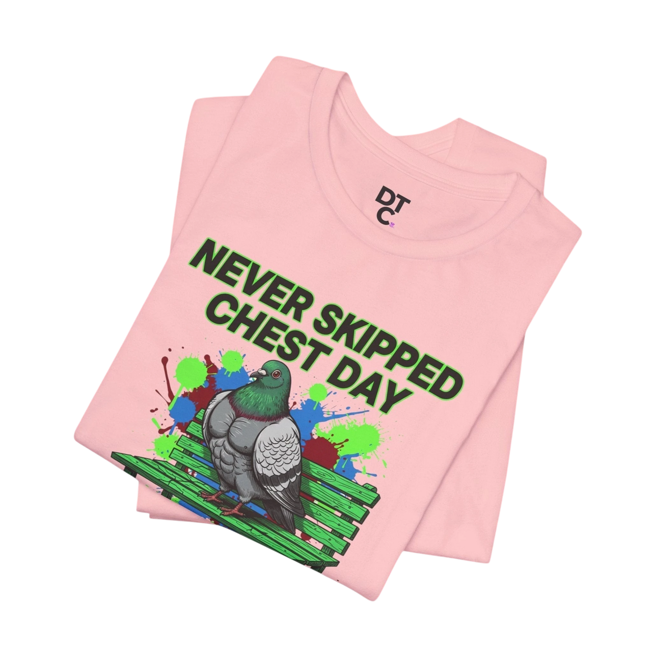 DailyThreadCo. pink cotton t-shirt with a graphic of a muscular pigeon on a park bench and the text "NEVER SKIPPED CHEST DAY".