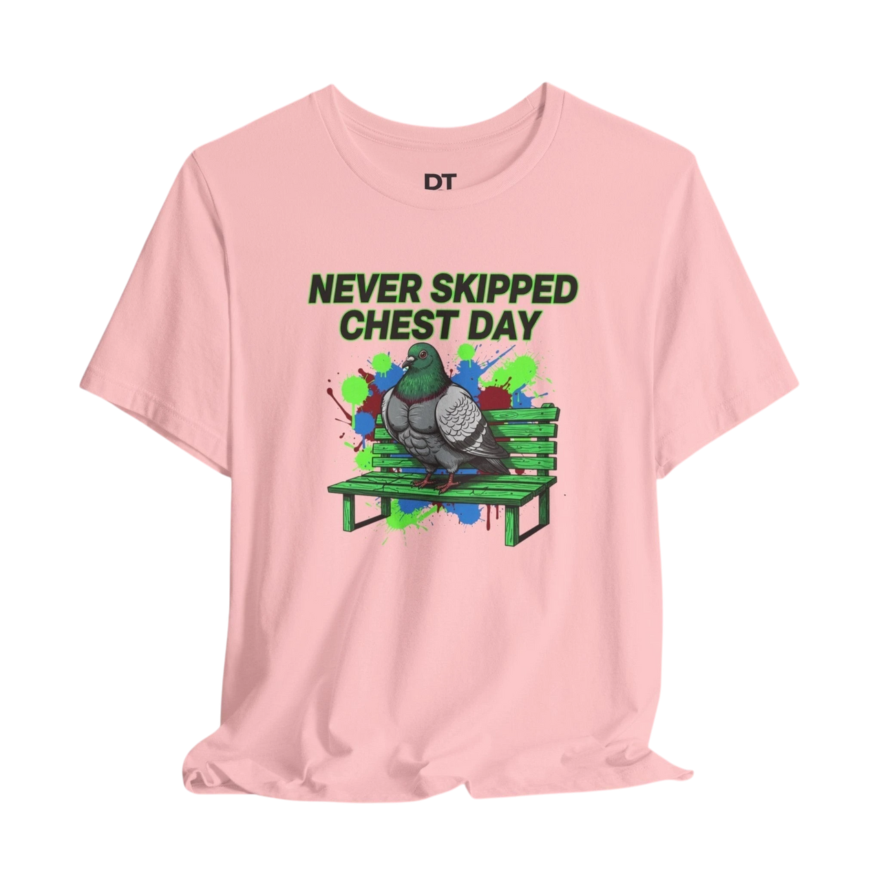 DailyThreadCo. pink cotton t-shirt with a graphic of a muscular pigeon on a green park bench. Text reads "NEVER SKIPPED CHEST DAY".