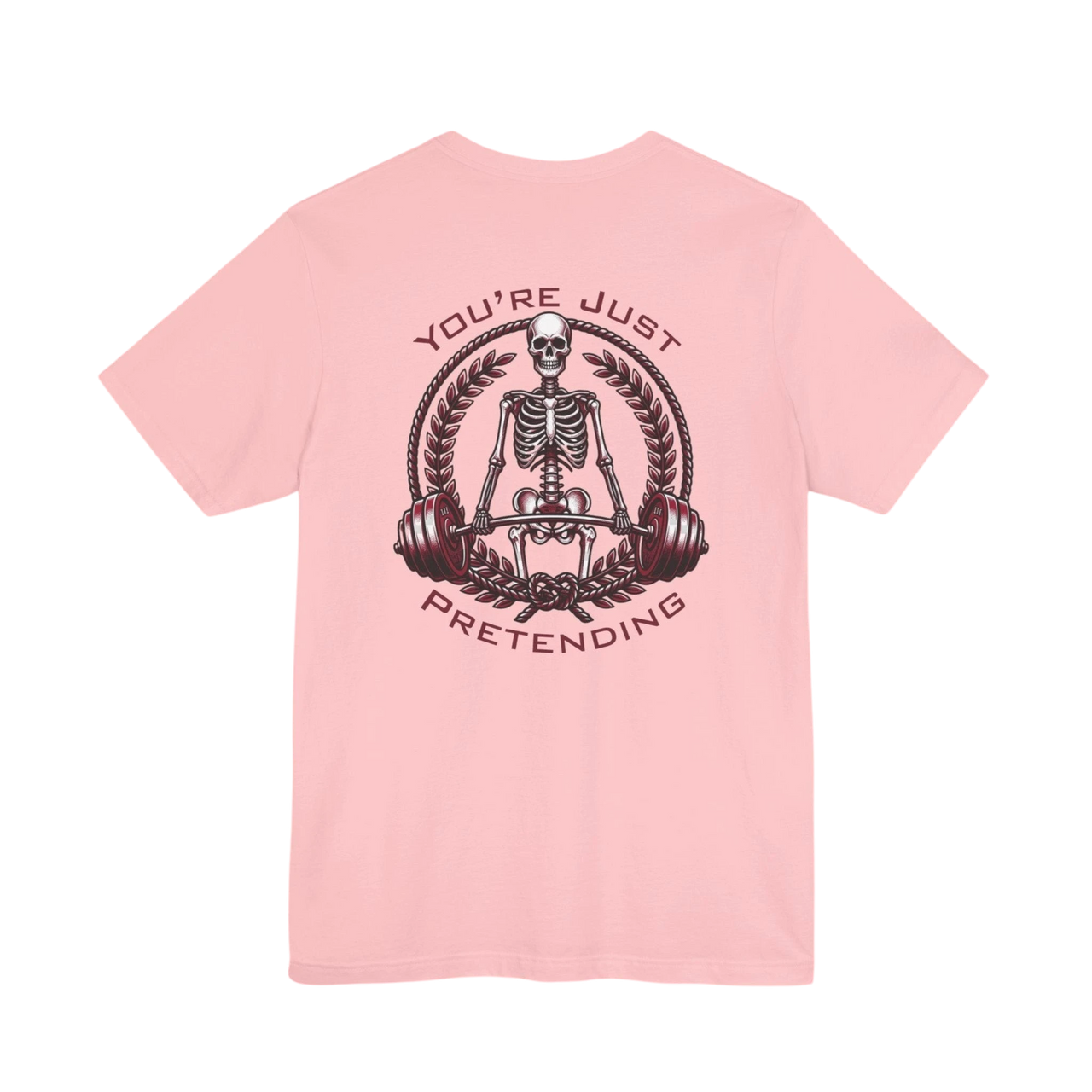 DailyThreadCo. light pink 100% cotton t-shirt with a skeleton weightlifter graphic and "You're Just Pretending" text.