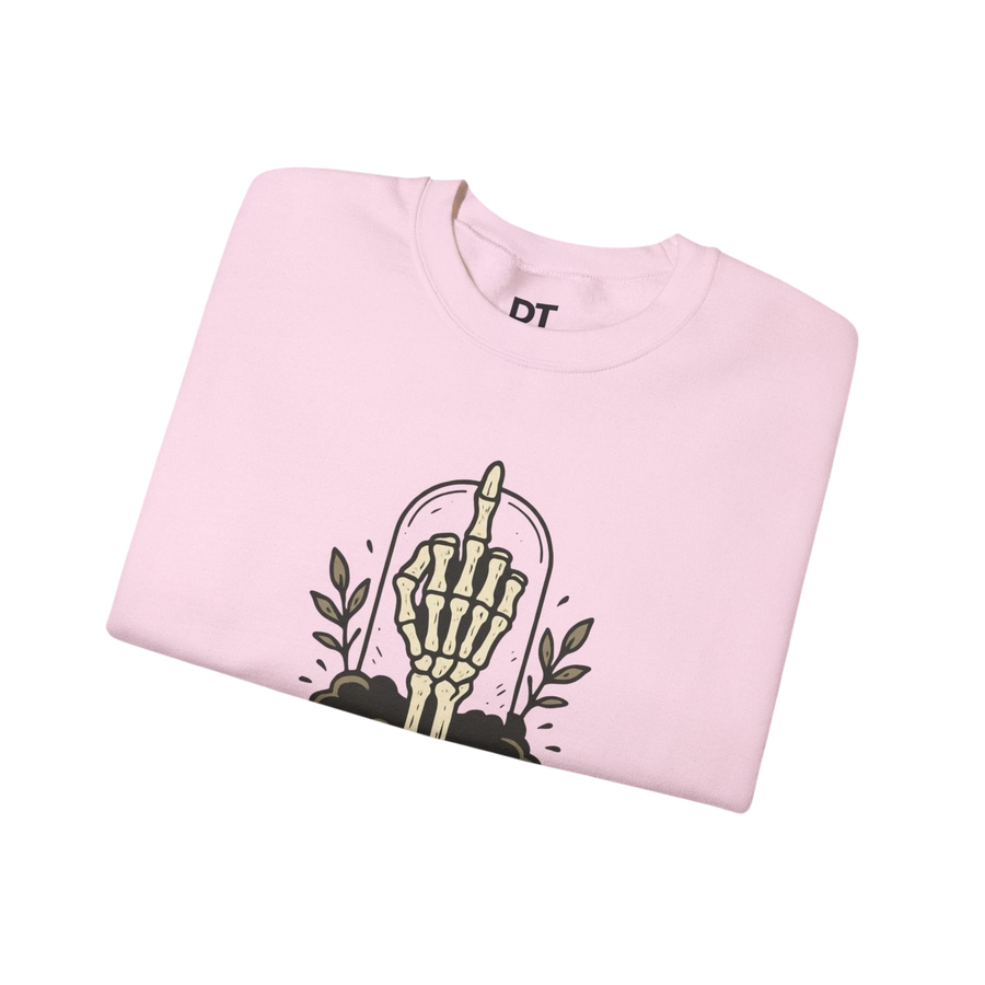 DailyThreadCo. light pink crewneck sweatshirt with a graphic of a skeleton hand giving the middle finger inside a glass dome, surrounded by leaves.
