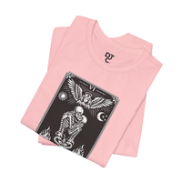 DailyThreadCo. pink cotton t-shirt with black and white 'The Lovers' tarot card graphic featuring skeletons, an angel, sun, moon, and flames.