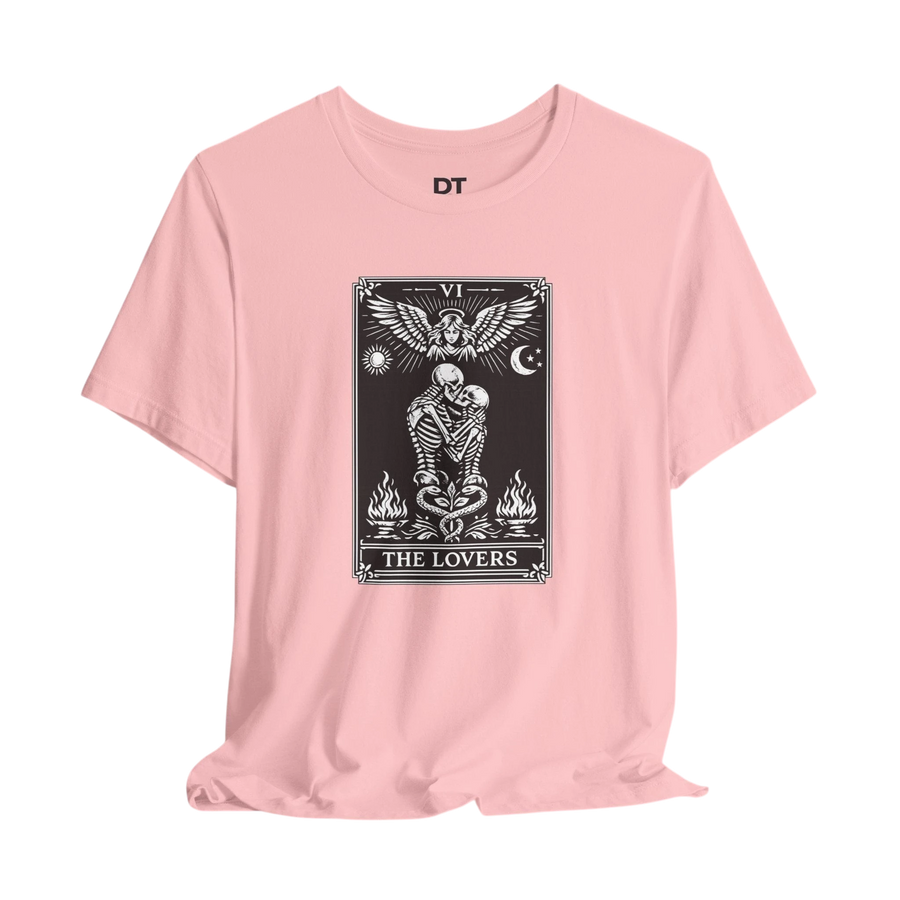 DailyThreadCo. pink cotton t-shirt with a black and white graphic of The Lovers tarot card, featuring skeleton figures, an angel, sun, moon, and flames.