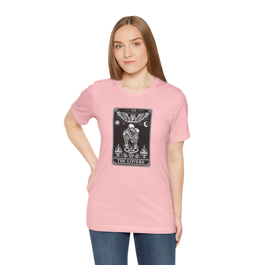 DailyThreadCo. pink cotton t-shirt with black and white 'The Lovers' tarot card graphic. Features skeletons embracing under an angel.