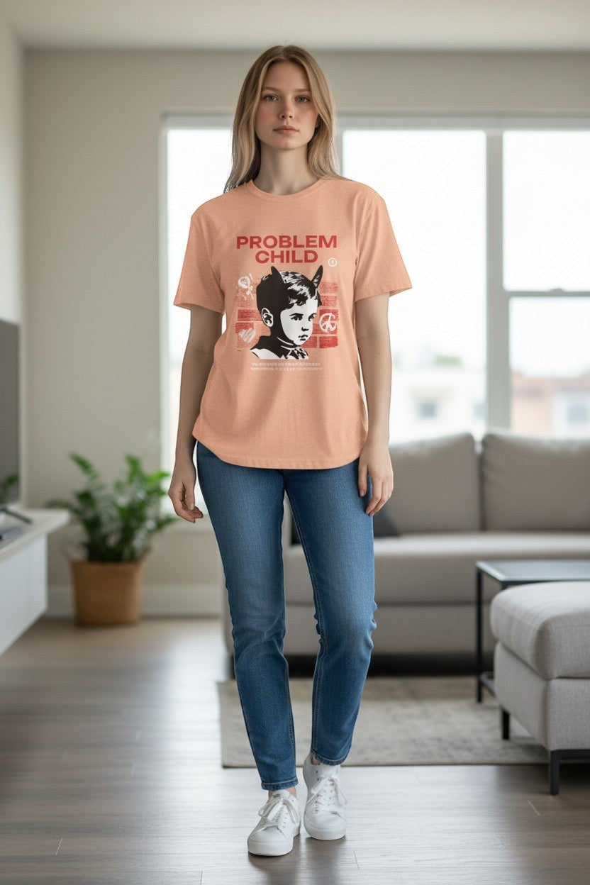 DailyThreadCo. peach cotton t-shirt with retro punk 'Problem Child' graphic featuring a devilish boy, roses, and peace sign.