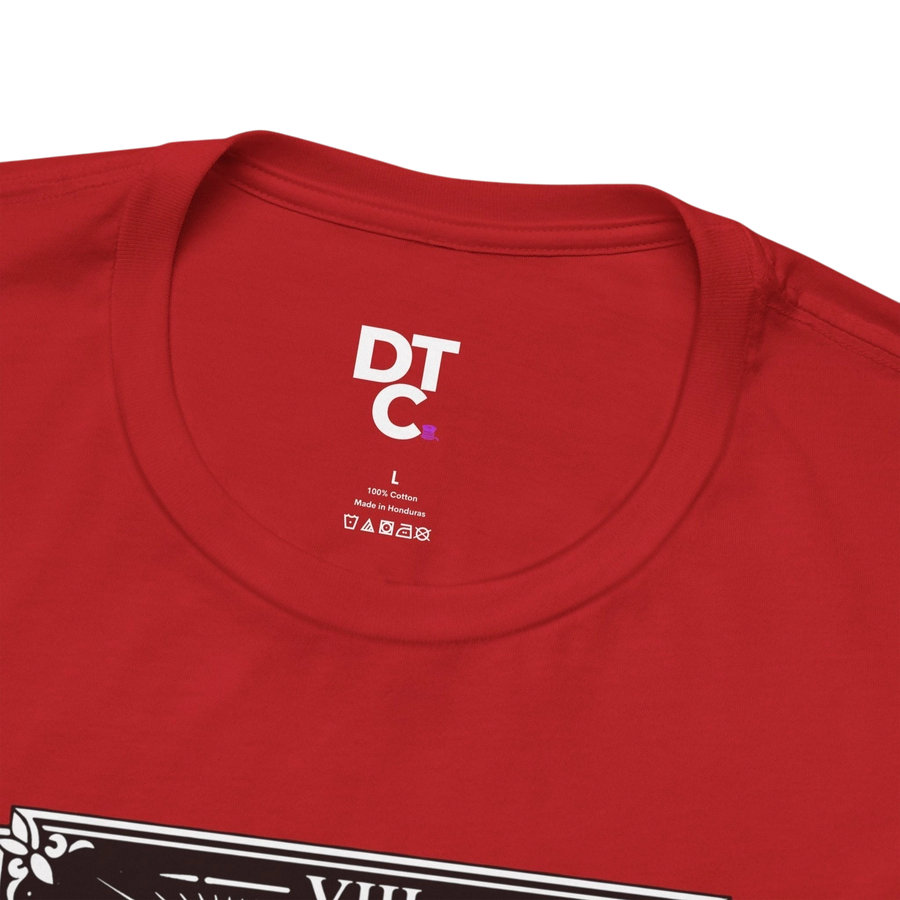 DailyThreadCo. red 100% cotton crew neck t-shirt with vintage Strength tarot card illustration of woman and lion.