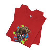 DailyThreadCo red 100% cotton t-shirt with graphic of a honey badger lifting a bear, set against a colorful paint splash background.