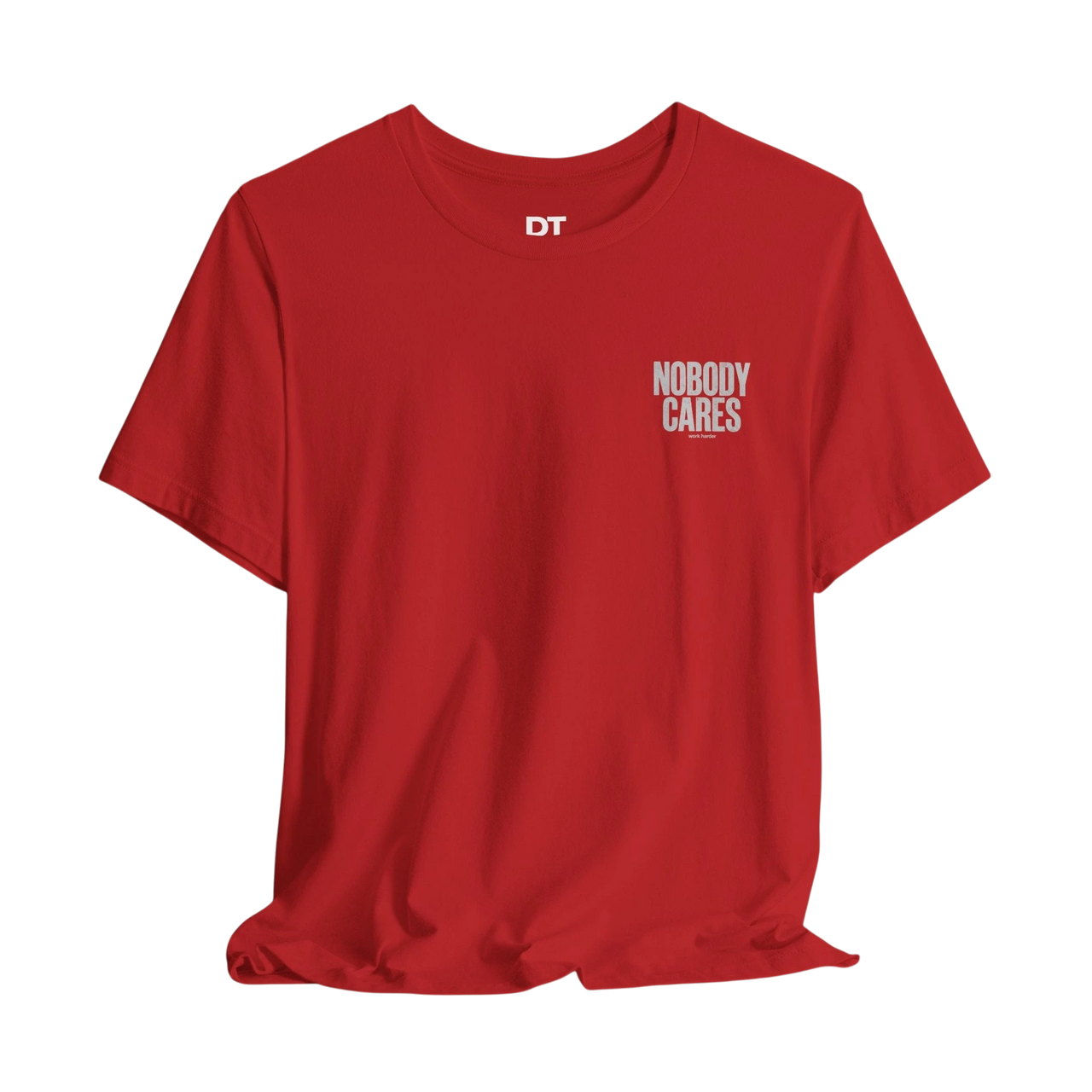 DailyThreadCo. red cotton graphic tee with "NOBODY CARES" text art on the chest and DT logo on the neck.