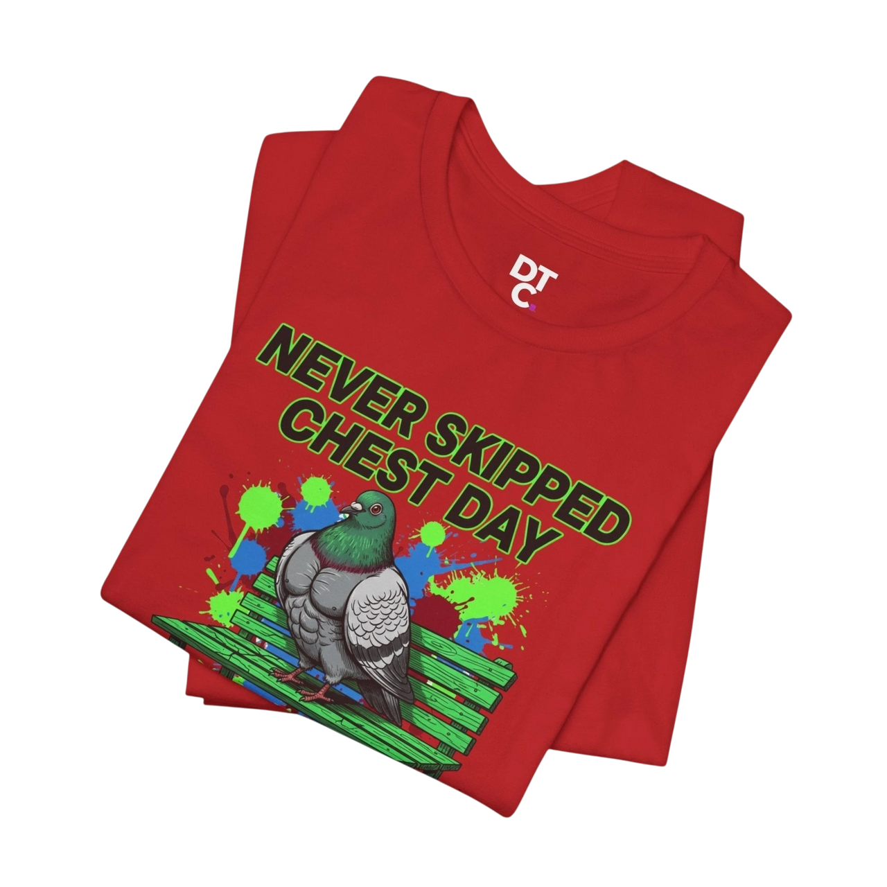 DailyThreadCo. red cotton t-shirt with a graphic print of a muscular pigeon on a bench, text reads "NEVER SKIPPED CHEST DAY".