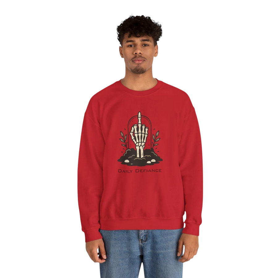 DailyThreadCo. red crewneck sweatshirt with a skeleton hand graphic giving the middle finger, surrounded by foliage and the words "Daily Defiance".