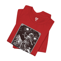 DailyThreadCo. red cotton t-shirt with 'The Fool' tarot card graphic print in black and white, featuring a skeleton figure, mountain, and sun.