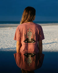 DailyThreadCo. Muted rose 100% cotton t-shirt with a skeleton hand graphic and 
