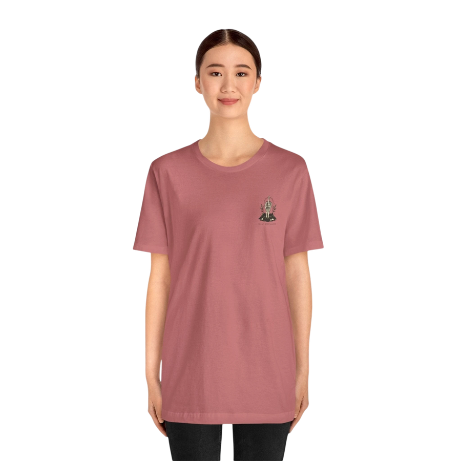 DailyThreadCo. Muted rose 100% cotton t-shirt with a small gothic skeleton hand graphic on the chest.