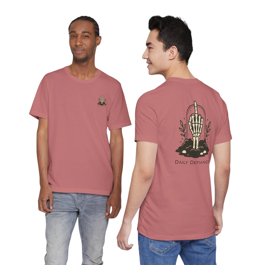 DailyThreadCo. Muted rose 100% cotton t-shirt with a skeleton hand graphic on the back and a small chest emblem. Features a vintage, rebellious style.