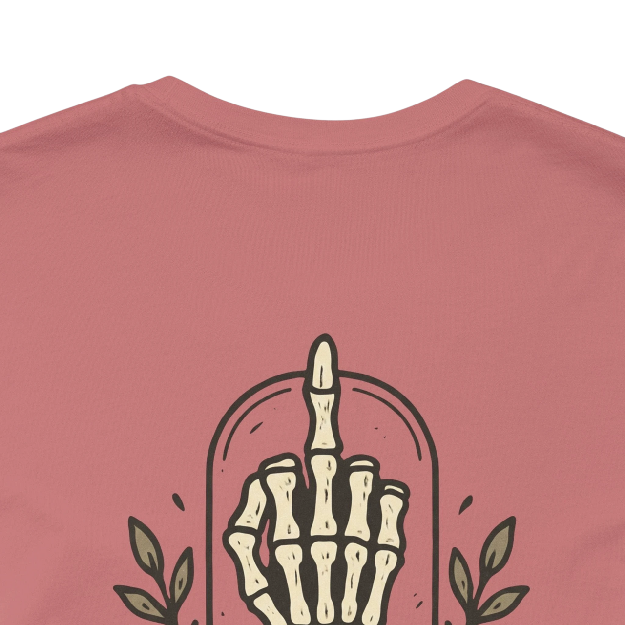 DailyThreadCo. muted rose 100% cotton t-shirt with a skeleton hand graphic giving the middle finger.