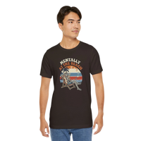 DailyThreadCo. dark brown 100% cotton t-shirt with a retro graphic of a skeleton relaxing in a beach chair under palm trees, text reads 