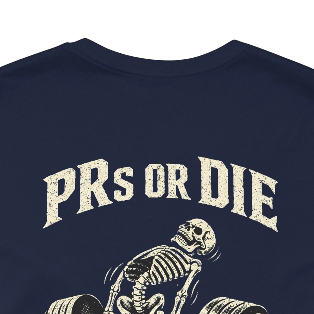 DailyThreadCo. navy blue 100% cotton t-shirt with a vintage-style skeleton deadlifting graphic and "PRs or Die" text.