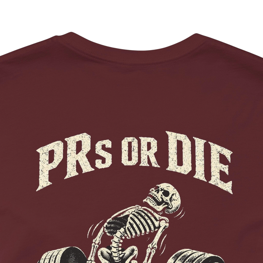 DailyThreadCo. maroon 100% cotton t-shirt with a vintage skeleton deadlifting graphic and "PRs or Die" text.