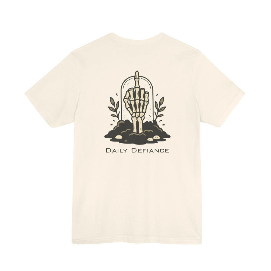 DailyThreadCo. cream 100% cotton t-shirt with a graphic of a skeleton hand rising from the ground with leaves and the text Daily Defiance.