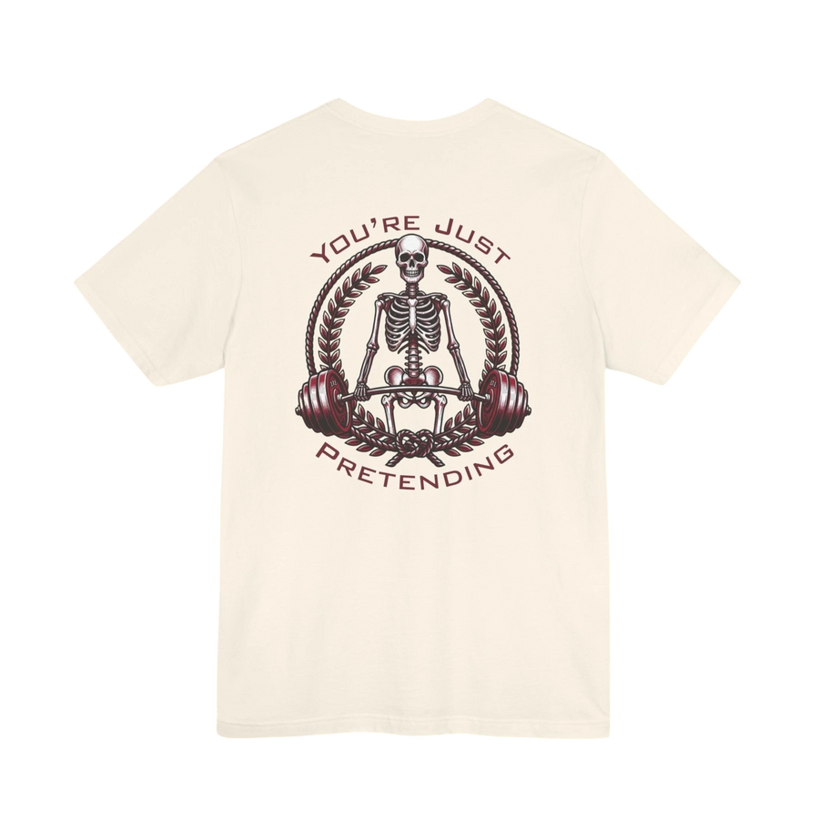 DailyThreadCo. cream 100% cotton t-shirt with a skeleton weightlifter graphic and "You're Just Pretending" text.