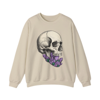 DailyThreadCo. cream crewneck sweatshirt with a detailed black and white skull graphic adorned with purple crystals in its mouth.