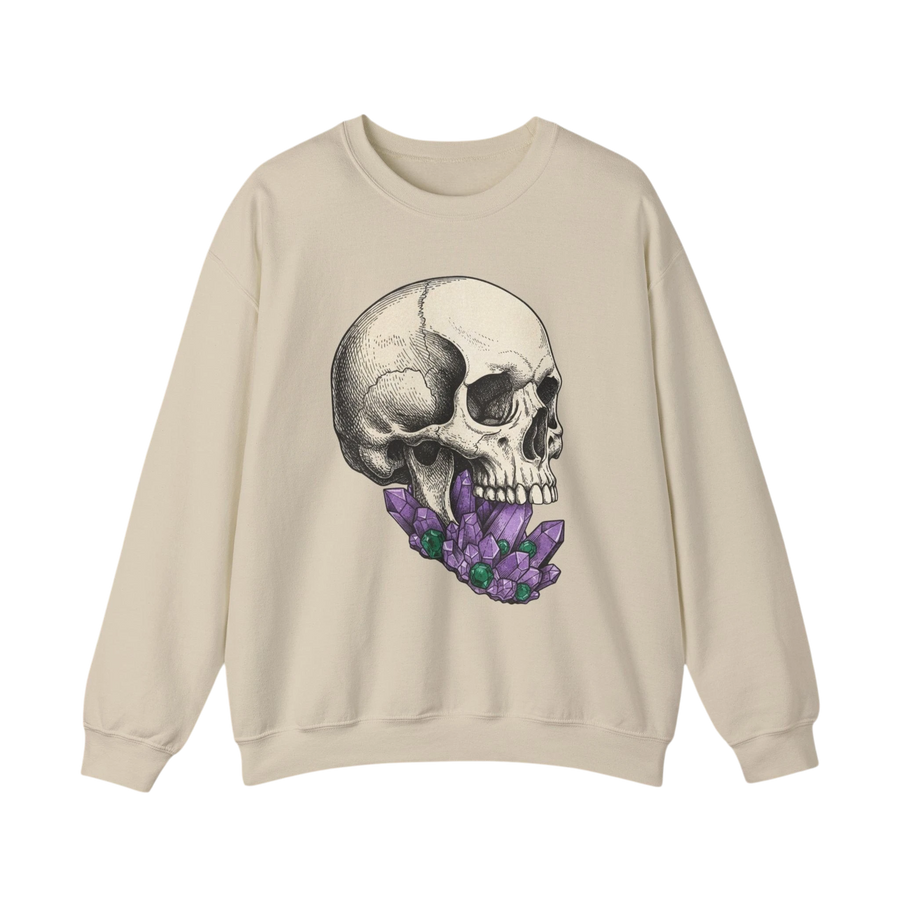DailyThreadCo. cream crewneck sweatshirt with a detailed black and white skull graphic adorned with purple crystals in its mouth.