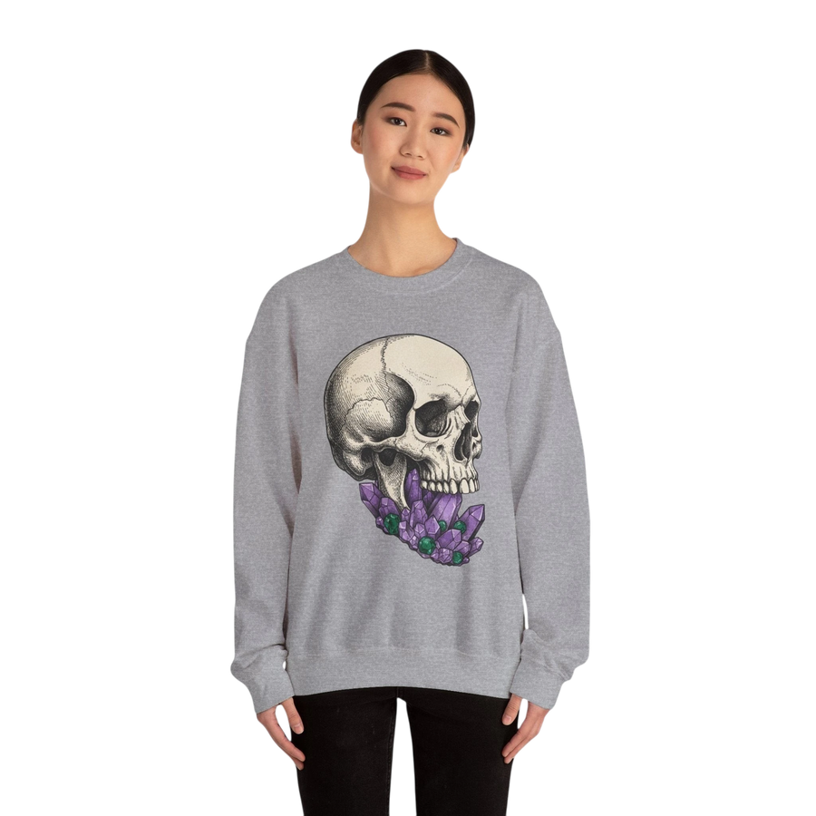 DailyThreadCo. grey crewneck sweatshirt with a detailed skull graphic adorned with purple crystals. Cotton-poly blend.