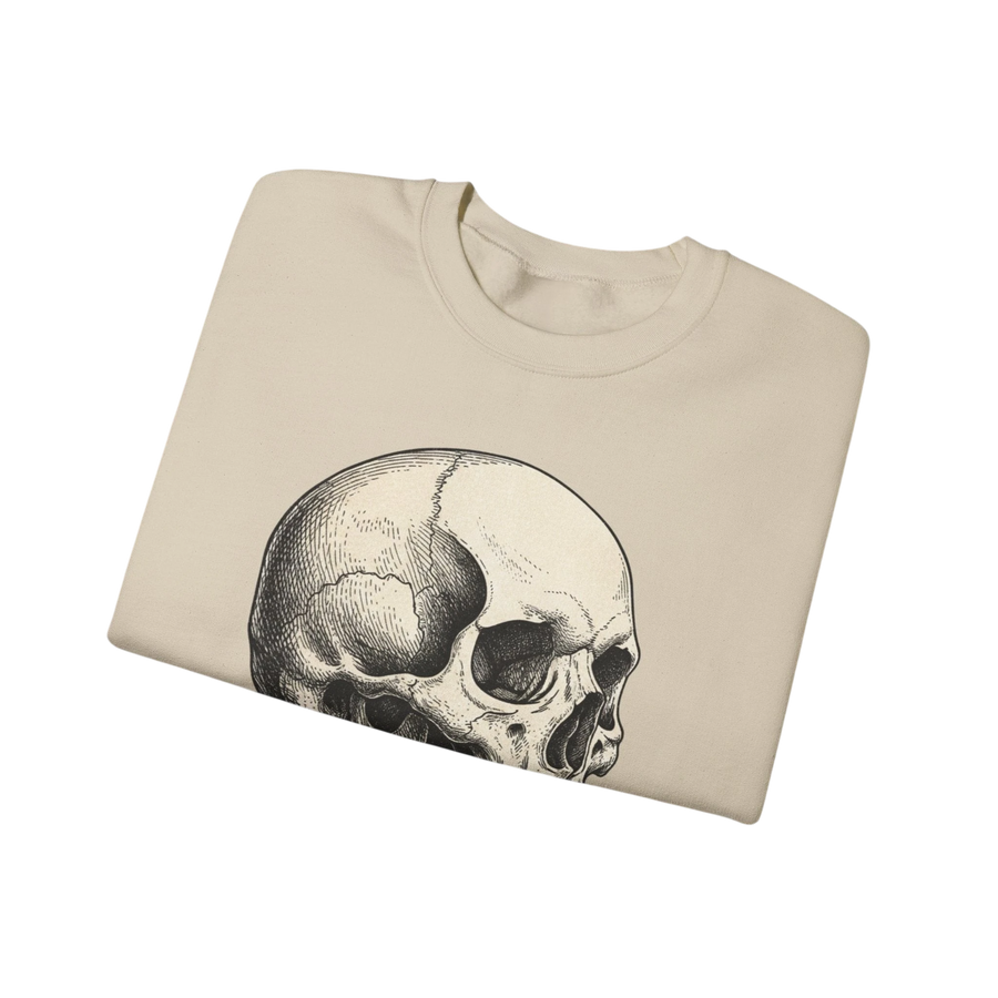 DailyThreadCo. cream crewneck sweatshirt with a detailed black ink anatomical skull graphic on the chest, featuring subtle purple crystal accents.