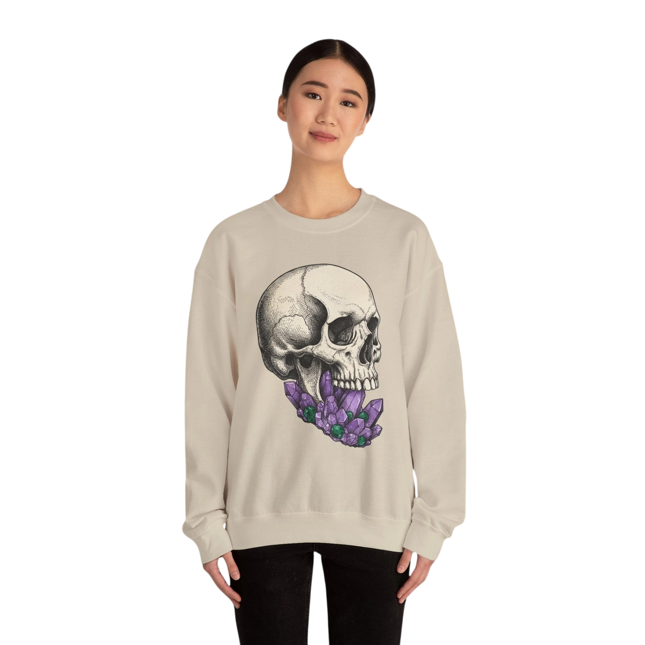 DailyThreadCo. cream crewneck sweatshirt with a black line drawing of a skull with purple crystals emerging from its mouth.