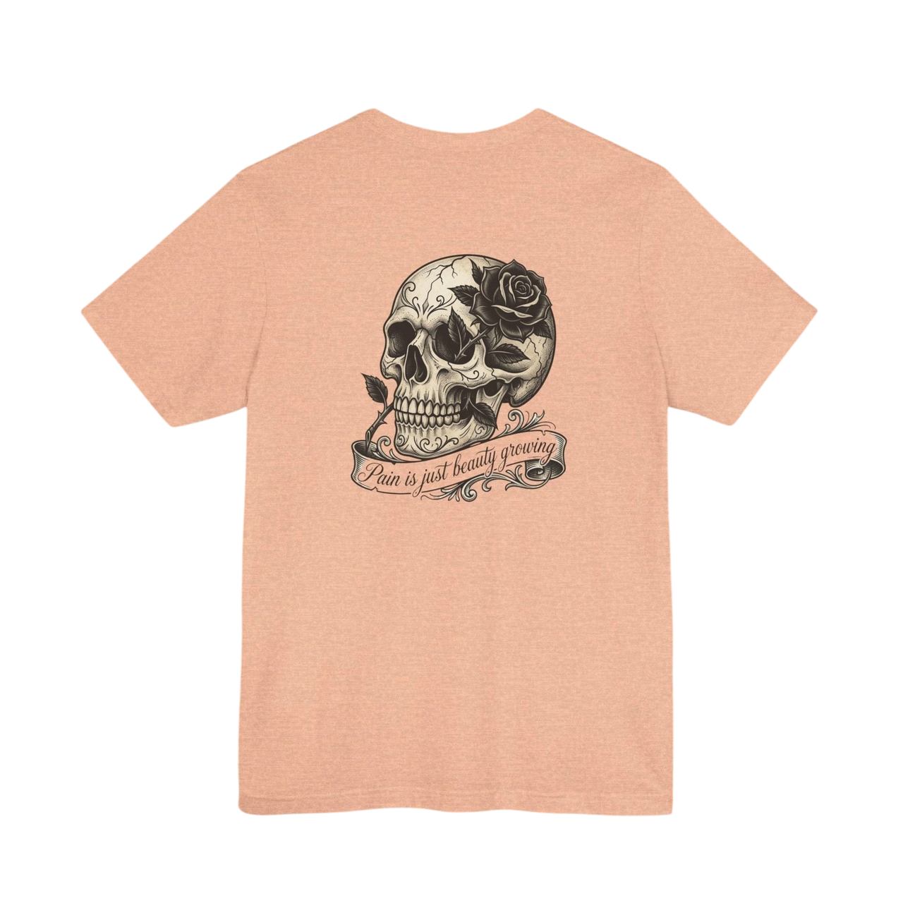 DailyThreadCo. peach cotton tee with hand-drawn skull and rose graphic on back. Text reads "Pain is just beauty growing".