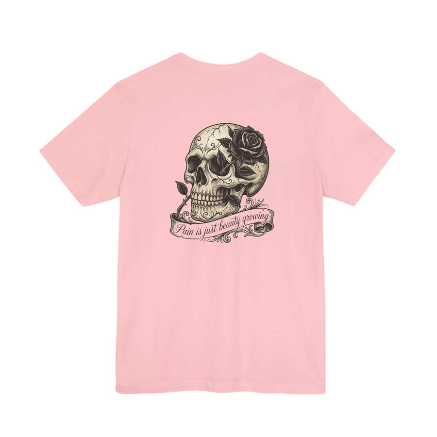 DailyThreadCo. pink cotton t-shirt with a graphic of a skull with a black rose and a banner that reads "Pain is just beauty growing".